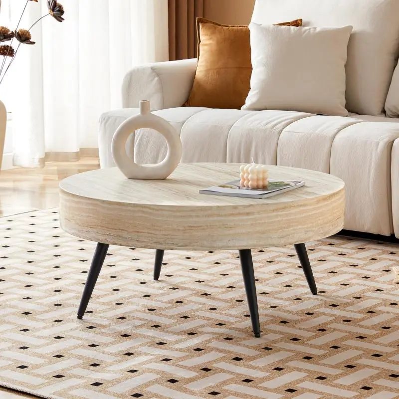 Round coffee table (70 cm diameter) featuring a light travertine/wood-look finish (MDF) and black metal legs.Minimalist design, ideal for living rooms and small spaces.
